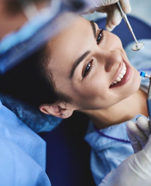 Patient receiving teeth cleaning