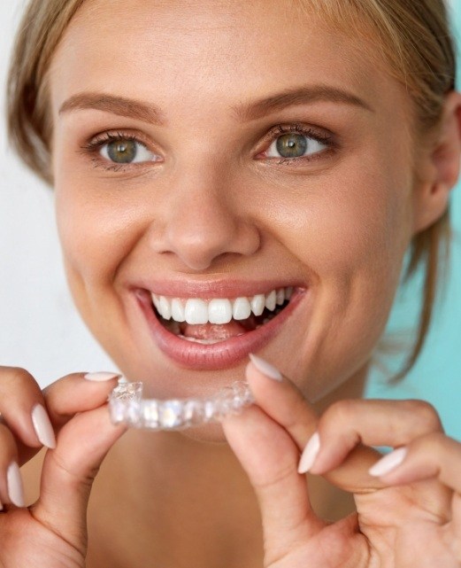 Woman placing Clear Correct tray