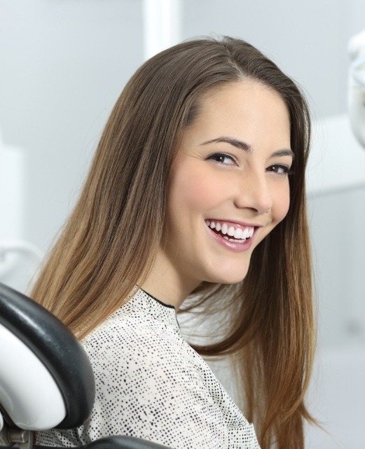 Woman smiling after dental treatment