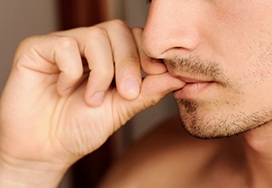 Man biting his thumbnail