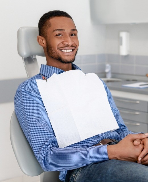 Man in dental chair smiling