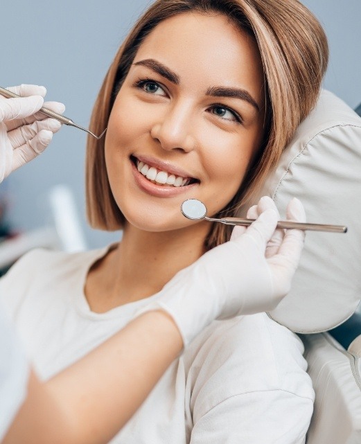 Woman in dental chair smiling