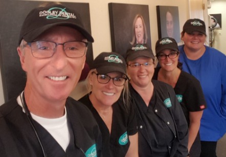 Doctor Dooley and his dental team in the dental office