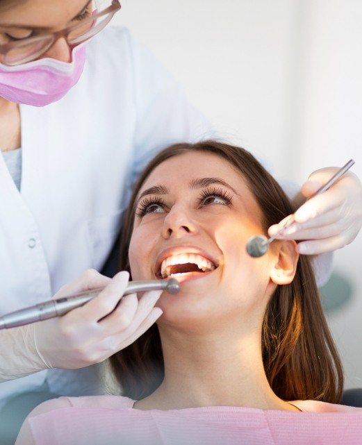 Relaxing dental patient receiving root canal therapy