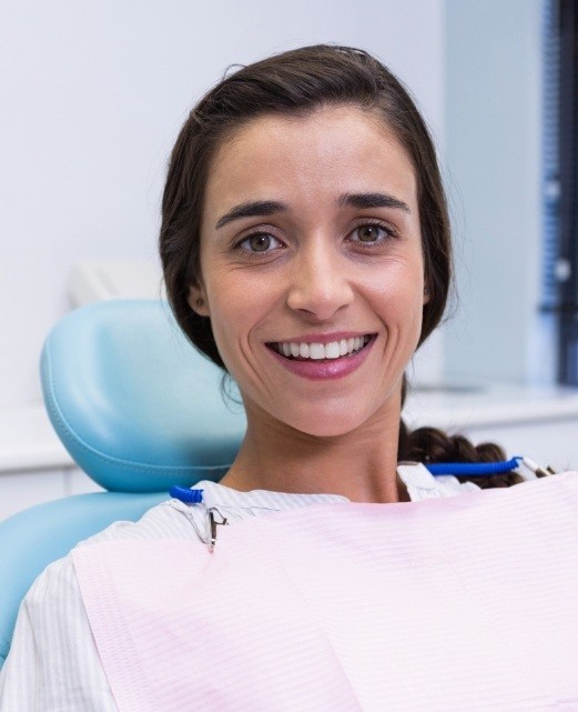 Woman in dental chair smiling