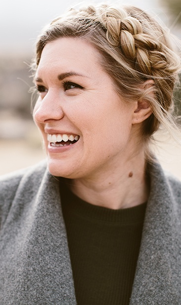 Woman smiling after sedation dentistry visit