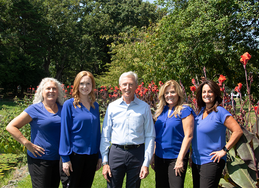 Doctor Dooley and the Dooley Dental team outdoors