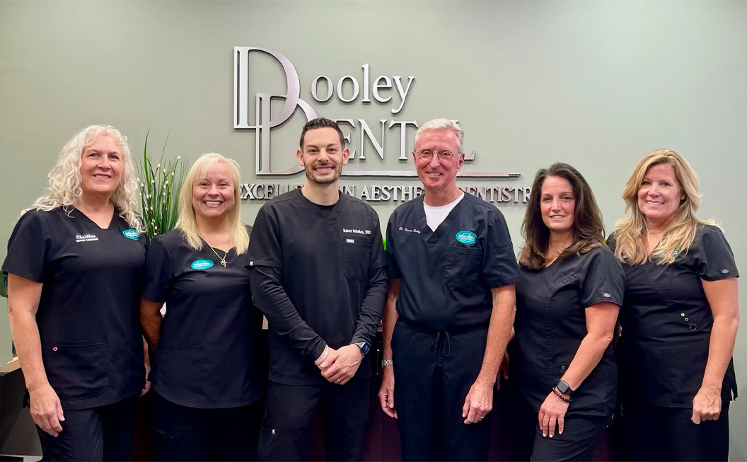 Doctor Dooley and the Dooley Dental team outdoors