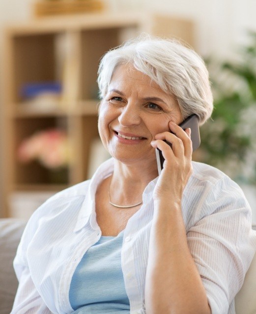 Woman contacting dental office to schedule an appointment