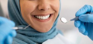 a woman smiling after her smile makeover