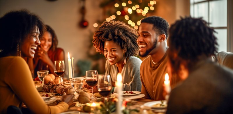 A family enjoying Thanksgiving Dinner with great oral health