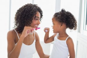 mom child brushing