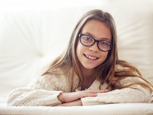 a young girl smiling