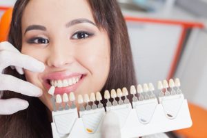 woman posing with porcelain veneers