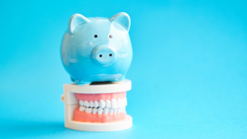 Piggy bank on model of teeth