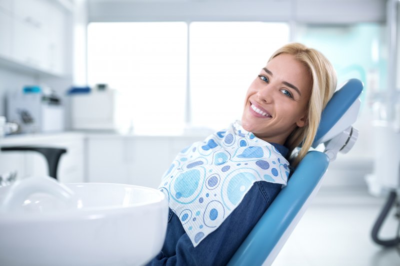 Woman smiling at routine dental appointment